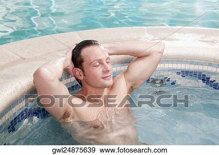 Man relaxing in a hot tub View Large Photo Image Stock Photo - Man relaxing in a hot tub. Fotosearch