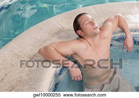 Man relaxing in a hot tub View Large Photo Image Stock Photography - Man relaxing in a hot tub. Fotosearch