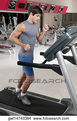 Picture - Man running on a treadmill. Fotosearch