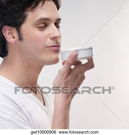 Man smelling bath salt View Large Photo Image Stock Photograph - Man smelling bath salt. Fotosearch