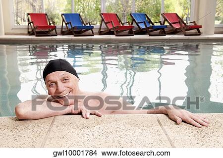 Man smiling in a swimming pool View Large Photo Image Picture - Man smiling in a swimming pool. Fotosearch