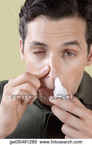 Man using nasal spray View Large Photo Image Stock Photo - Man using nasal spray. Fotosearch