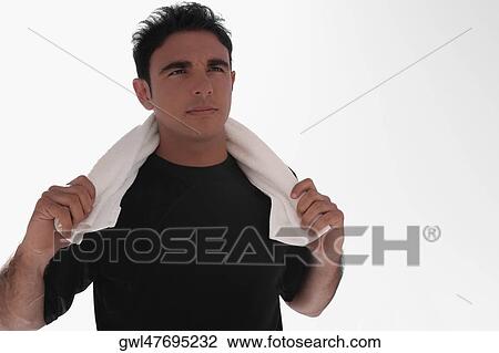 Man using towel after exercise View Large Photo Image Stock Image - Man using towel after exercise. Fotosearch