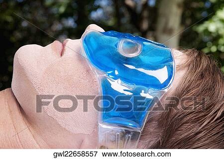 Man wearing eye mask View Large Photo Image Stock Photo - Man wearing eye mask. Fotosearch