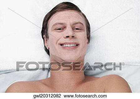 Man with face pack on his face View Large Photo Image Stock Image - Man with face pack on his face. Fotosearch