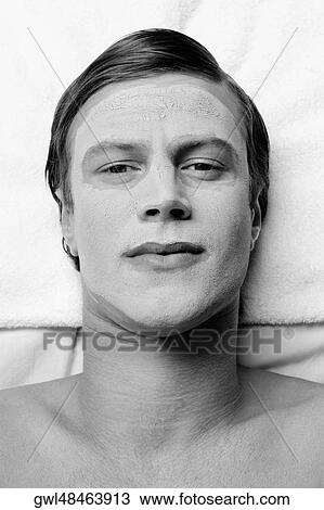 Man with face pack on his face View Large Photo Image Stock Image - Man with face pack on his face. Fotosearch