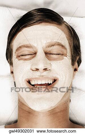 Man with face pack on his face View Large Photo Image Stock Image - Man with face pack on his face. Fotosearch