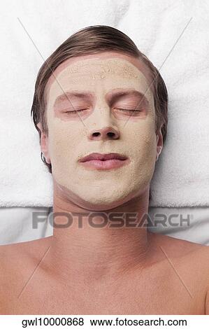 Man with face pack on his face View Large Photo Image Stock Photo - Man with face pack on his face. Fotosearch
