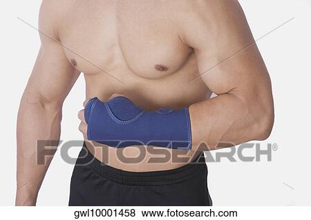 Mid section view of a bare chested man View Large Photo Image Stock Photo - Mid section view of a bare chested man. Fotosearch