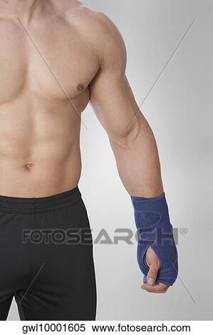 Mid section view of a bare chested man View Large Photo Image Stock Photography - Mid section view of a bare chested man. Fotosearch