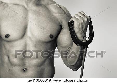 Mid section view of a man exercising with resistance band View Large Photo Image Stock Photo - Mid section view of a man exercising with resistance band. Fotosearch