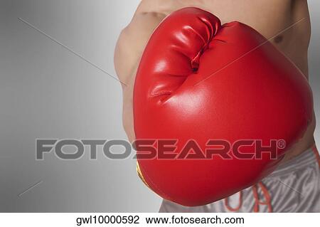 Mid section view of a man in boxing stance View Large Photo Image Stock Image - Mid section view of a man in boxing stance. Fotosearch