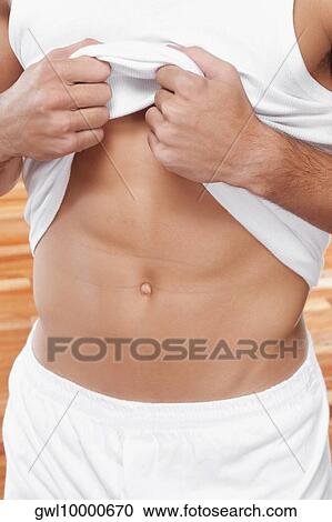 Mid section view of a man showing his waist View Large Photo Image Stock Image - Mid section view of a man showing his waist. Fotosearch