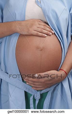 Mid section view of a pregnant woman in a hospital View Large Photo Image Stock Image - Mid section view of a pregnant woman in a hospital. Fotosearch