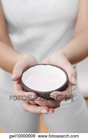 Mid section view of a woman holding a bowl of bath salt View Large Photo Image Stock Photo - Mid section view of a woman holding a bowl of bath salt. Fotosearch