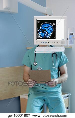 MRI scan of brain on a computer screen with a surgeon sitting behind it View Large Photo Image Stock Photo - MRI scan of brain on a computer screen with a surgeon sitting behind it. Fotosearch