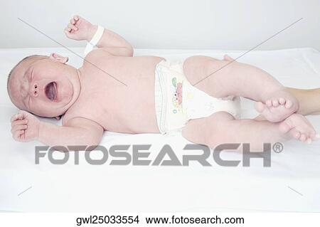 Newborn baby crying on the bed View Large Photo Image Picture - Newborn baby crying on the bed. Fotosearch