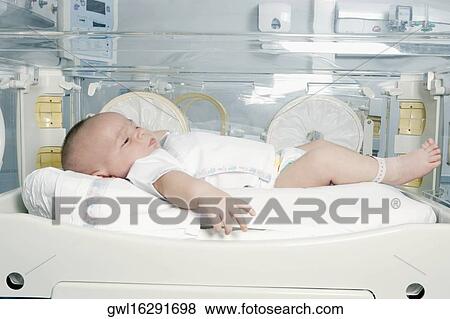 Newborn baby in a hospital View Large Photo Image Stock Photo - Newborn baby in a hospital. Fotosearch