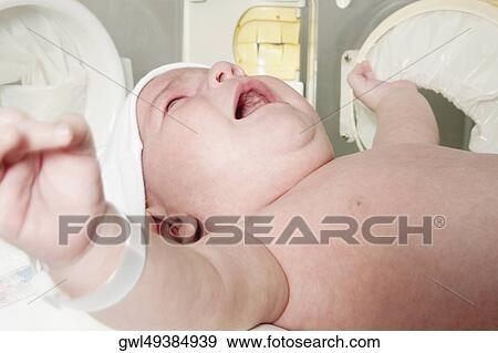 Newborn baby in a hospital View Large Photo Image Stock Photo - Newborn baby in a hospital. Fotosearch