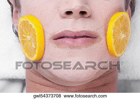 Orange slices on a man's face View Large Photo Image Stock Photo - Orange slices on a man's face. Fotosearch