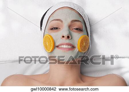 Orange slices on a woman's face View Large Photo Image Stock Image - Orange slices on a woman's face. Fotosearch