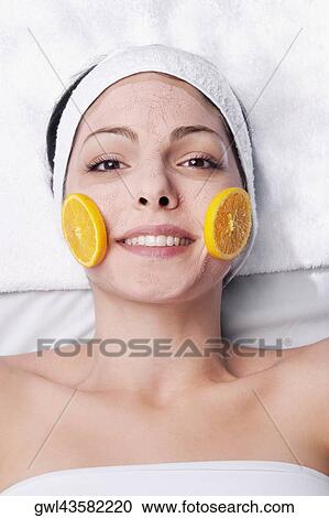 Orange slices on a woman's face View Large Photo Image Stock Image - Orange slices on a woman's face. Fotosearch