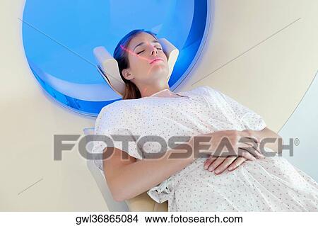 Picture - Patient going through an MRI scan. Fotosearch