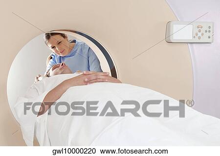 Patient going through an MRI scan View Large Photo Image Stock Image - Patient going through an MRI scan. Fotosearch