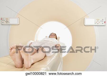 Patient going through an MRI scan View Large Photo Image Stock Image - Patient going through an MRI scan. Fotosearch