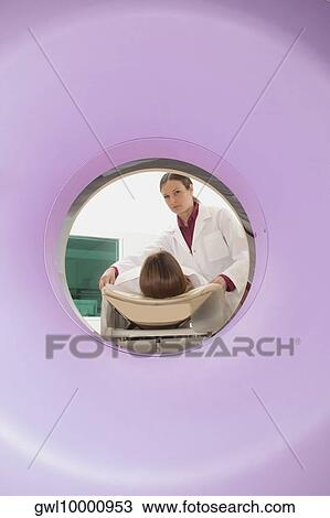 Patient going through an MRI scan View Large Photo Image Stock Image - Patient going through an MRI scan. Fotosearch