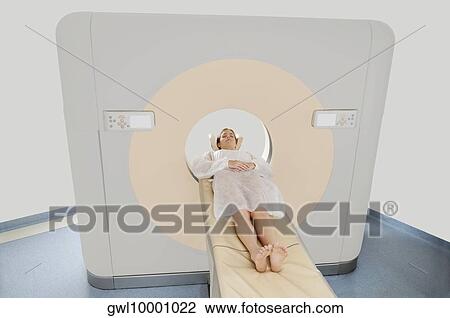 Stock Image - Patient going through an MRI scan. Fotosearch