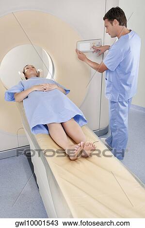 Patient going through an MRI scan View Large Photo Image Stock Image - Patient going through an MRI scan. Fotosearch