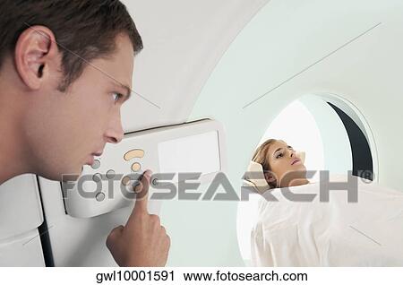 Stock Image - Patient going through an MRI scan. Fotosearch