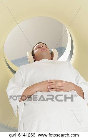 Patient going through an MRI scan View Large Photo Image Stock Image - Patient going through an MRI scan. Fotosearch