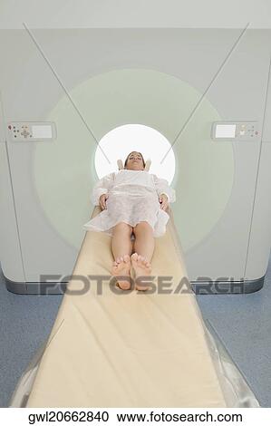 Patient going through an MRI scan View Large Photo Image Stock Image - Patient going through an MRI scan. Fotosearch