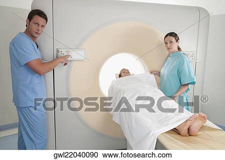 Patient going through an MRI scan View Large Photo Image Stock Image - Patient going through an MRI scan. Fotosearch