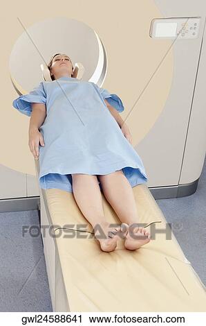 Patient going through an MRI scan View Large Photo Image Stock Image - Patient going through an MRI scan. Fotosearch