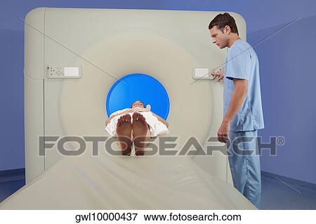 Patient going through an MRI scan View Large Photo Image Stock Photo - Patient going through an MRI scan. Fotosearch