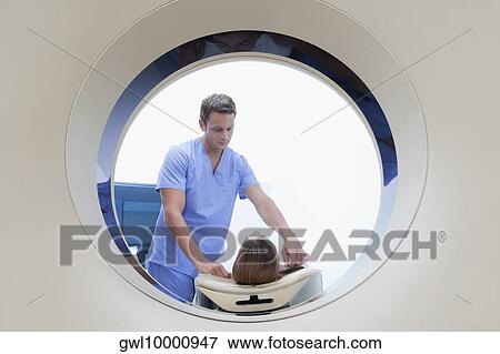 Patient going through an MRI scan View Large Photo Image Stock Photo - Patient going through an MRI scan. Fotosearch