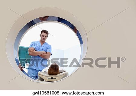 Patient going through an MRI scan View Large Photo Image Stock Photo - Patient going through an MRI scan. Fotosearch