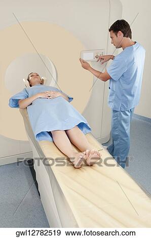 Patient going through an MRI scan View Large Photo Image Stock Photo - Patient going through an MRI scan. Fotosearch