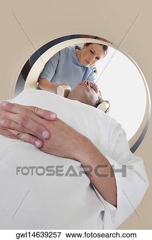Patient going through an MRI scan View Large Photo Image Stock Photo - Patient going through an MRI scan. Fotosearch