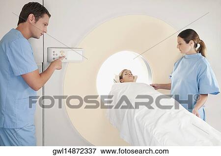Patient going through an MRI scan View Large Photo Image Stock Photo - Patient going through an MRI scan. Fotosearch