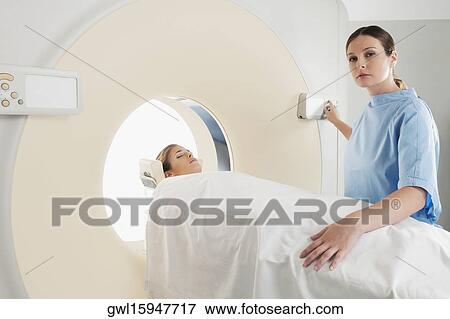 Patient going through an MRI scan View Large Photo Image Stock Photo - Patient going through an MRI scan. Fotosearch