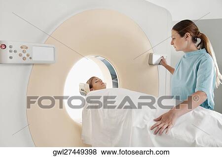 Patient going through an MRI scan View Large Photo Image Stock Photo - Patient going through an MRI scan. Fotosearch