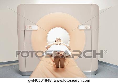 Patient going through an MRI scan View Large Photo Image Stock Photo - Patient going through an MRI scan. Fotosearch