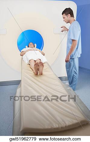 Patient going through an MRI scan View Large Photo Image Stock Photo - Patient going through an MRI scan. Fotosearch