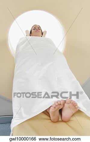 Patient going through an MRI scan View Large Photo Image Stock Photograph - Patient going through an MRI scan. Fotosearch