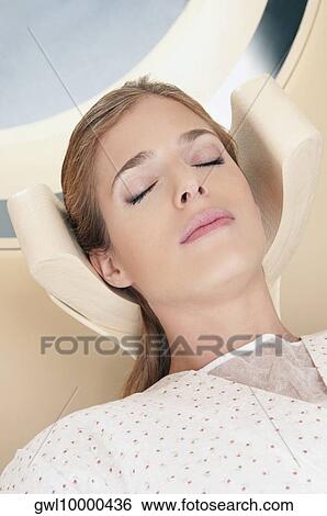 Patient going through an MRI scan View Large Photo Image Stock Photograph - Patient going through an MRI scan. Fotosearch