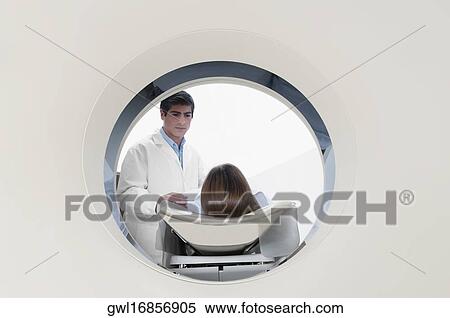 Stock Photography - Patient going through an MRI scan. Fotosearch